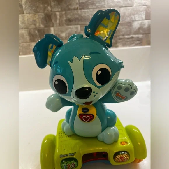 V-TECH HOVER PUP INTERACTIVE DOG 9-36 mos
HAS 3 ENGAGING PLAY MODES. SEE VIDEO - Picture 4 of 6